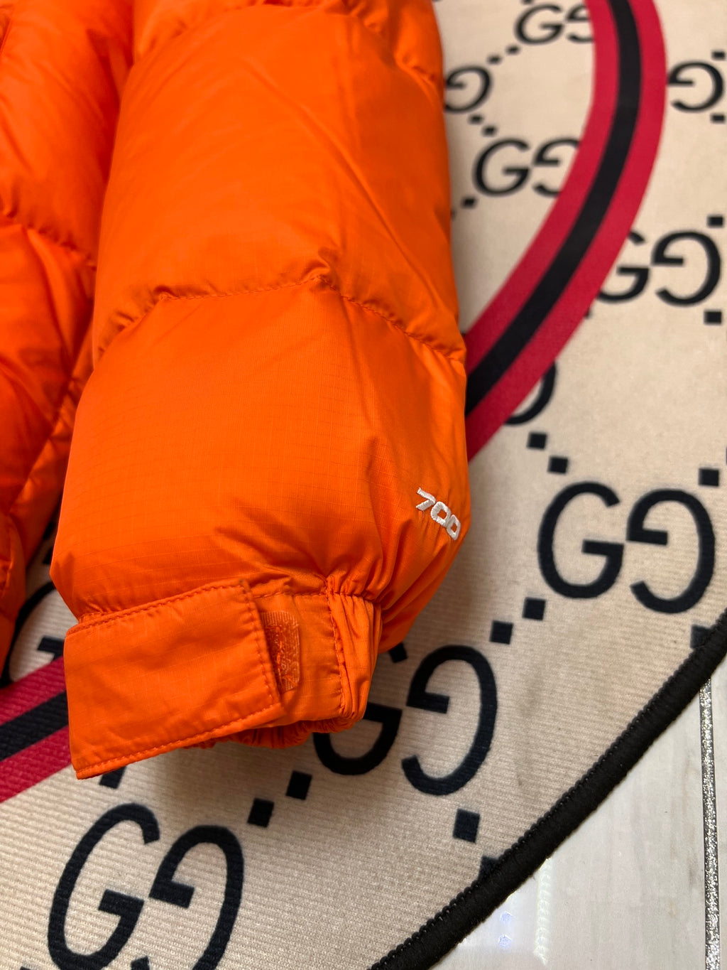 The North Face Orange and Black Colorblock Stand Collar Puffer Jacket