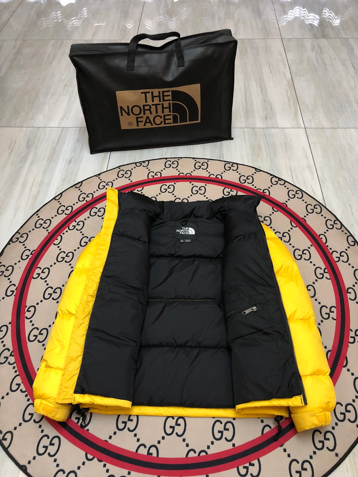 The North Face Yellow and Black Colorblock Stand Collar Puffer Jacket