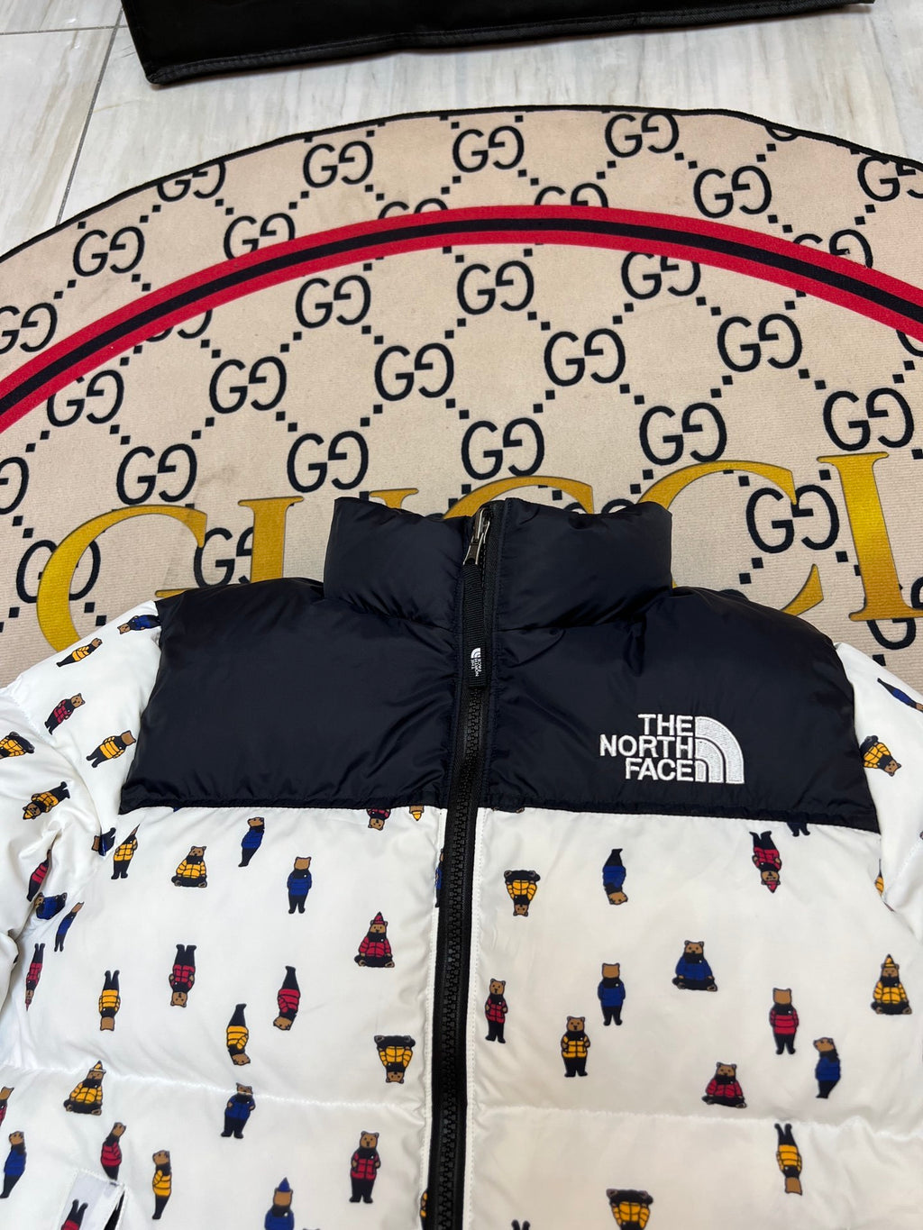 The North Face White and Black Bear Print Stand Collar Puffer Jacket