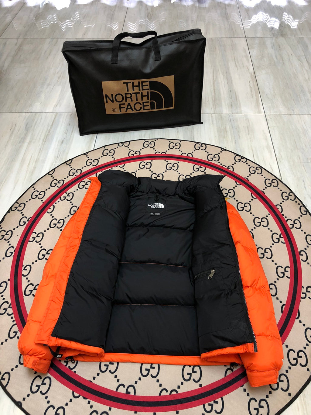 The North Face Orange and Black Colorblock Stand Collar Puffer Jacket