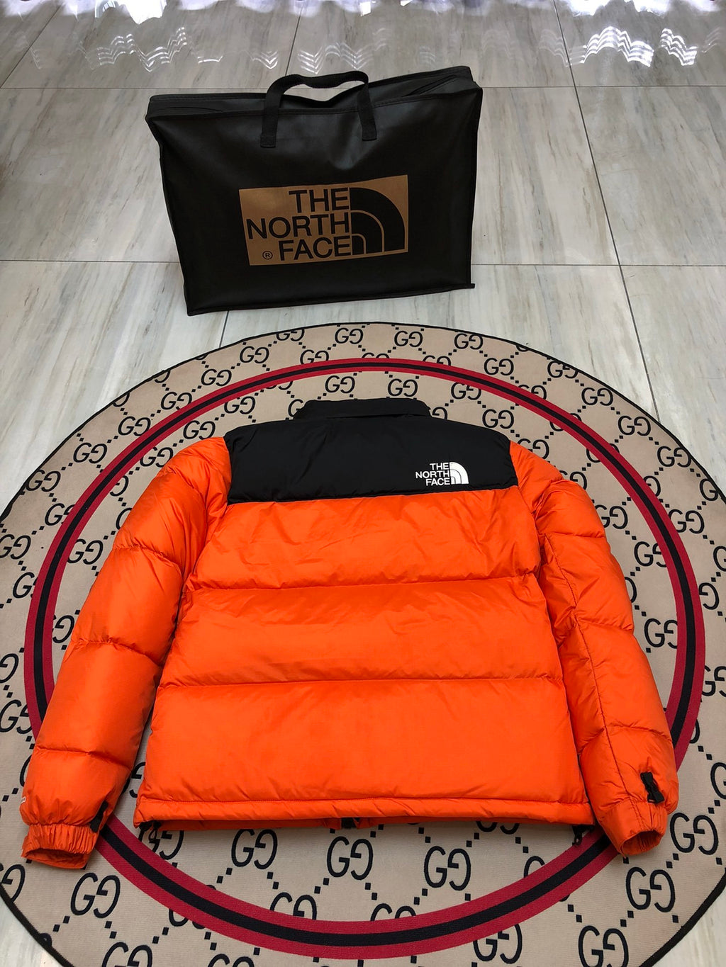 The North Face Orange and Black Colorblock Stand Collar Puffer Jacket