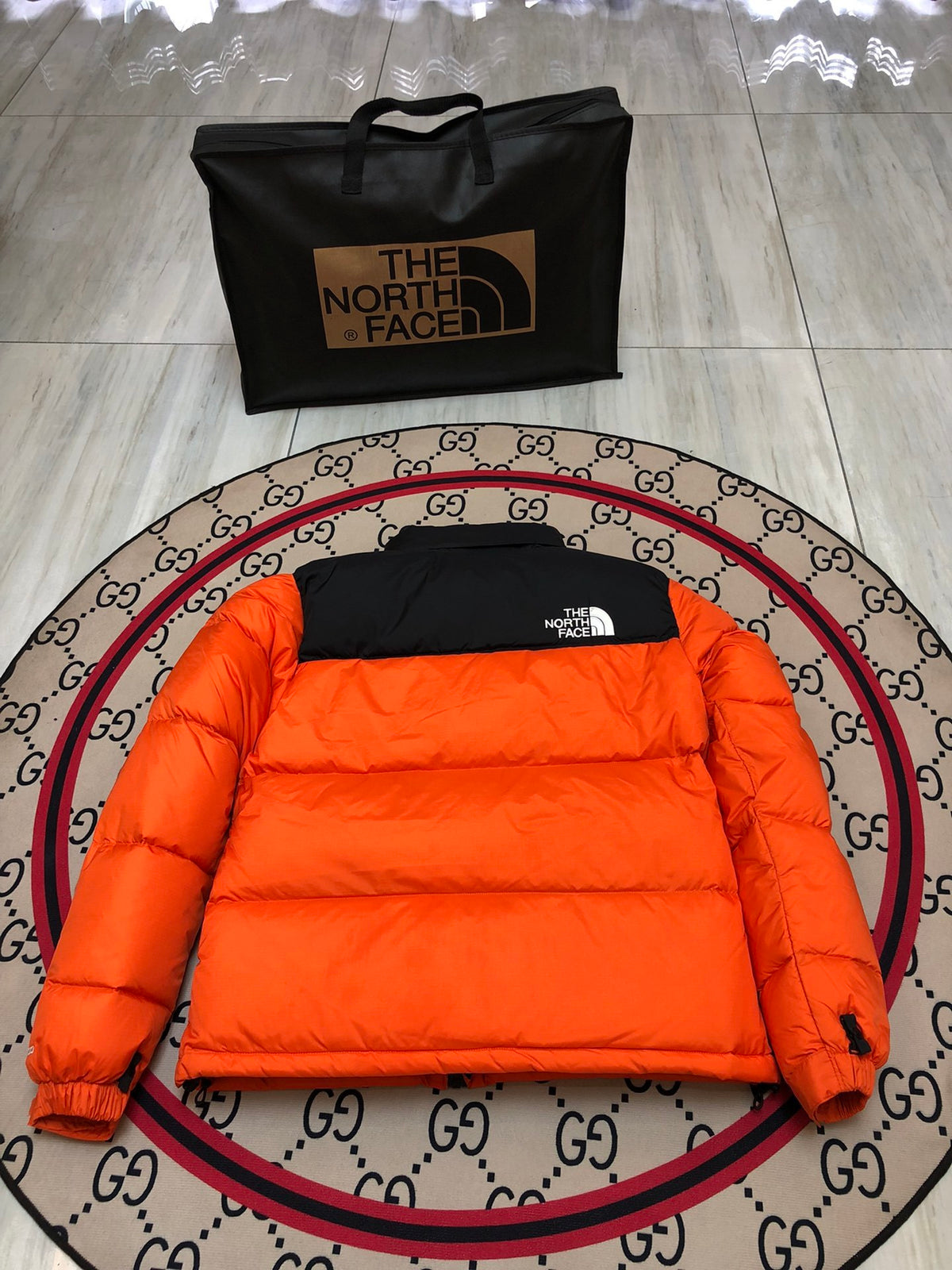 The North Face Orange and Black Colorblock Stand Collar Puffer Jacket